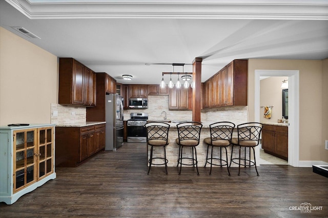 4748 Sassafras Ln, Naperville, IL 60564 - kitchen with stainless steel appliances, tasteful backsplash, a kitchen bar, and wood finished floors
