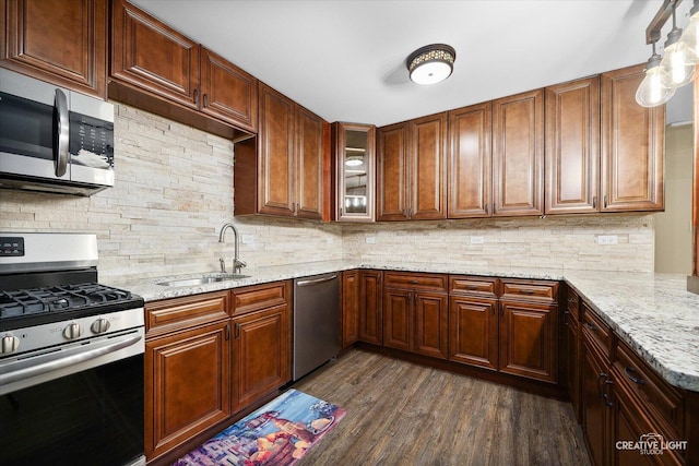 4748 Sassafras Ln, Naperville, IL 60564 - kitchen featuring appliances with stainless steel finishes, a sink, decorative backsplash, light stone counters, and dark wood-style flooring