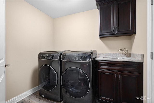 4748 Sassafras Ln, Naperville, IL 60564 - laundry area featuring cabinet space, washing machine and dryer, wood finished floors, and baseboards