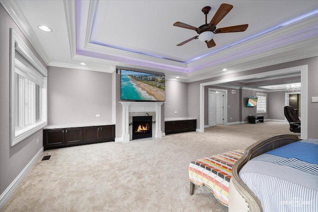 4748 Sassafras Ln, Naperville, IL 60564 - carpeted bedroom featuring a tray ceiling, ornamental molding, a high end fireplace, recessed lighting, and baseboards