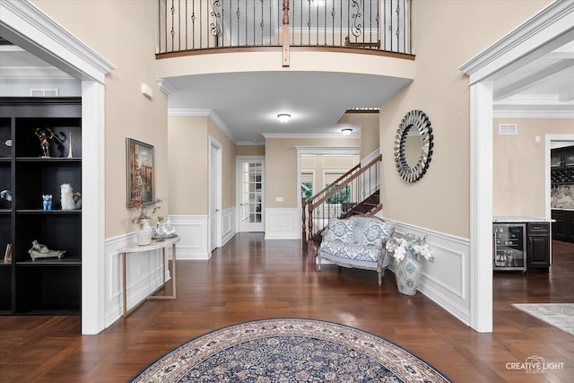 4748 Sassafras Ln, Naperville, IL 60564 - entryway featuring beverage cooler, stairway, a wainscoted wall, ornamental molding, and a decorative wall