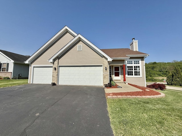 2123 Maxine Ln, Rockford, IL 61102 - ranch-style home featuring asphalt driveway, a garage, a front yard, a chimney, and brick siding
