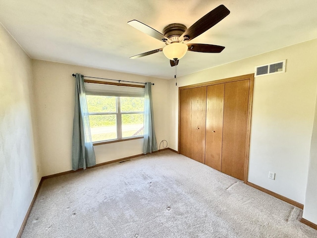 2123 Maxine Ln, Rockford, IL 61102 - unfurnished bedroom featuring carpet flooring, a closet, and a ceiling fan