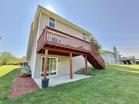 2123 Maxine Ln, Rockford, IL 61102 - back of house with a yard, a patio, a deck, and stairway