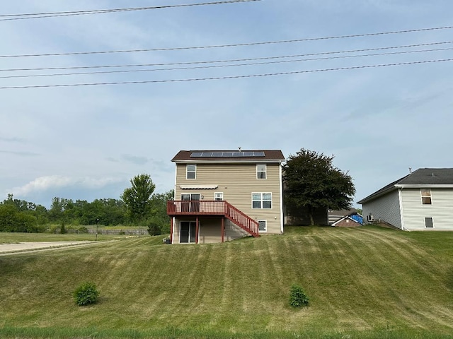 2123 Maxine Ln, Rockford, IL 61102 - rear view of house featuring a deck, solar panels, stairs, and a yard