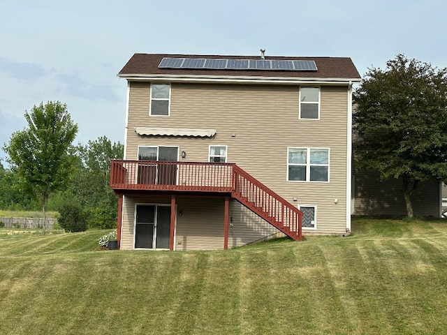 2123 Maxine Ln, Rockford, IL 61102 - rear view of property featuring a deck, stairs, a yard, and solar panels