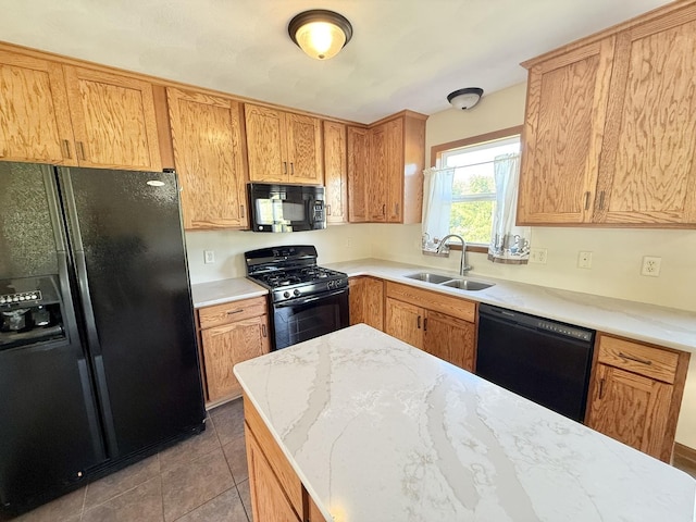 2123 Maxine Ln, Rockford, IL 61102 - kitchen featuring black appliances, light stone countertops, and light tile patterned floors