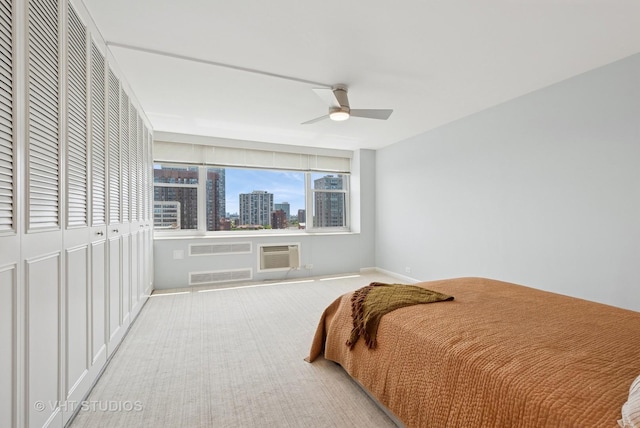4250 N Marine Dr Unit 1406, Chicago, IL 60613 - bedroom with carpet flooring, a skyline view, ceiling fan, baseboards, and a closet