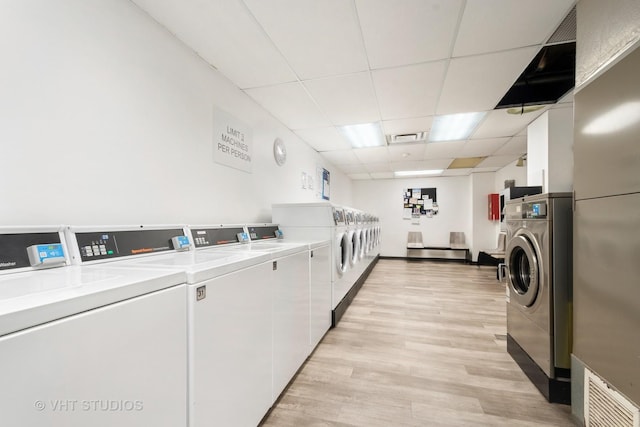 4250 N Marine Dr Unit 1406, Chicago, IL 60613 - communal laundry room with washing machine and dryer, light wood-style floors, and stacked washer / dryer