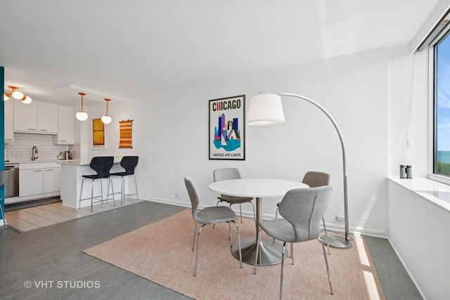 4250 N Marine Dr Unit 1406, Chicago, IL 60613 - dining area featuring healthy amount of natural light and baseboards