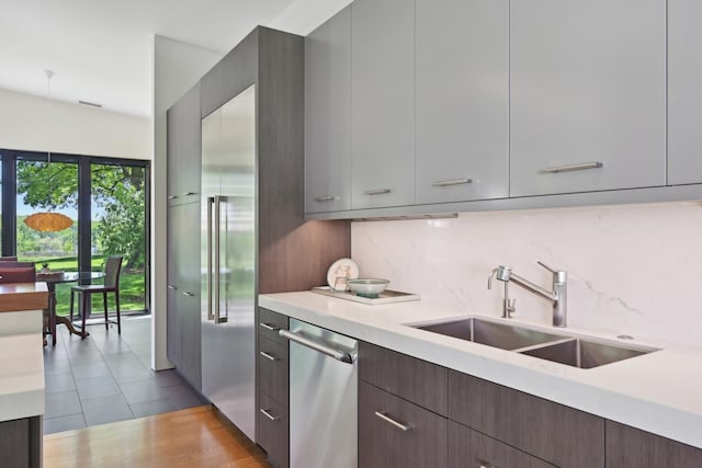 4N575 Old Quarry Rd, Saint Charles, IL 60174 - kitchen with a sink, appliances with stainless steel finishes, modern cabinets, light countertops, and tasteful backsplash