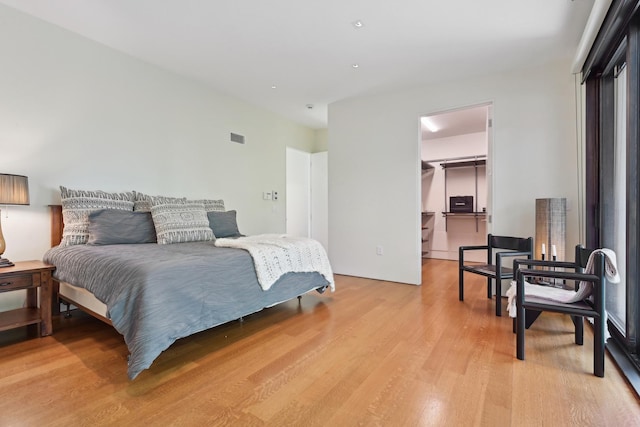 4N575 Old Quarry Rd, Saint Charles, IL 60174 - bedroom with light wood-style floors, a walk in closet, and a closet