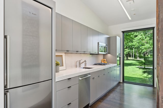 4N575 Old Quarry Rd, Saint Charles, IL 60174 - kitchen featuring stainless steel appliances, a sink, gray cabinets, light countertops, and dark wood-style flooring