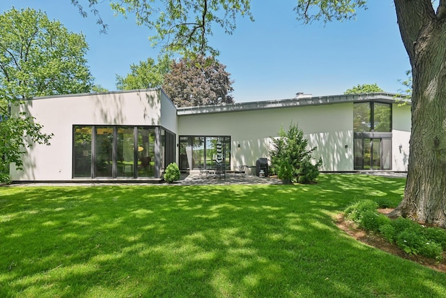 4N575 Old Quarry Rd, Saint Charles, IL 60174 - rear view of property with stucco siding, a lawn, and a patio