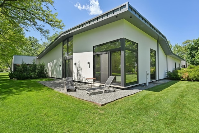 4N575 Old Quarry Rd, Saint Charles, IL 60174 - back of property featuring stucco siding, a yard, and a patio area