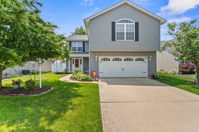 3807 Sandstone Dr, Champaign, IL 61822 - view of front of property featuring an attached garage, a front lawn, driveway, and cooling unit