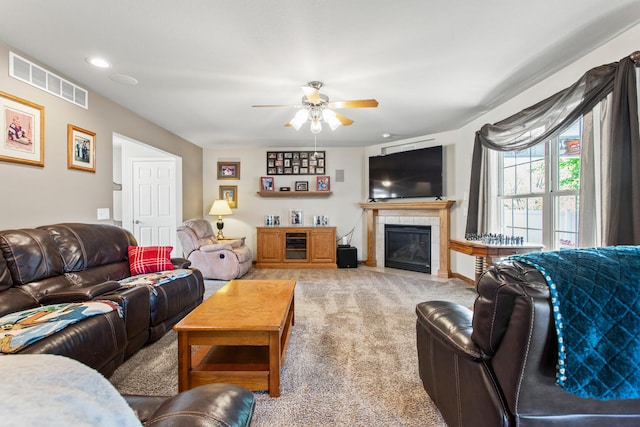 3807 Sandstone Dr, Champaign, IL 61822 - carpeted living area with a ceiling fan and a tiled fireplace