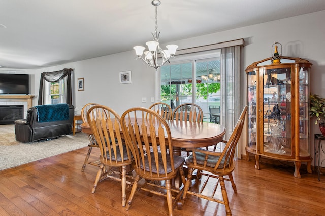 3807 Sandstone Dr, Champaign, IL 61822 - dining room featuring a chandelier, wood finished floors, and plenty of natural light
