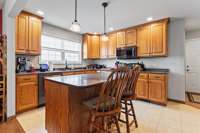 3807 Sandstone Dr, Champaign, IL 61822 - kitchen featuring dishwasher, a sink, stainless steel microwave, a center island, and recessed lighting