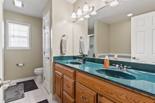 3807 Sandstone Dr, Champaign, IL 61822 - bathroom with double vanity, toilet, tile patterned flooring, and baseboards