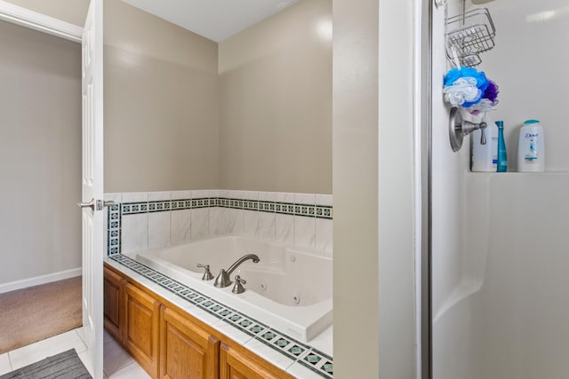 3807 Sandstone Dr, Champaign, IL 61822 - full bath featuring a jetted tub, tile patterned flooring, and baseboards