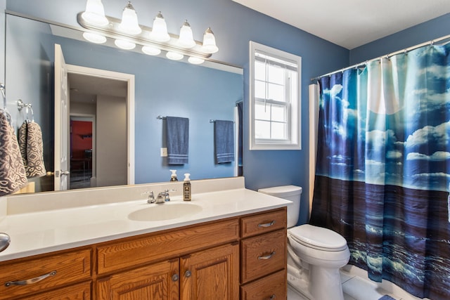 3807 Sandstone Dr, Champaign, IL 61822 - full bathroom featuring toilet, vanity, tile patterned flooring, and a shower with curtain