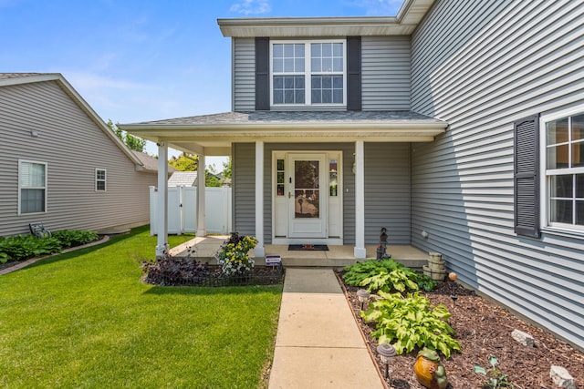 3807 Sandstone Dr, Champaign, IL 61822 - view of exterior entry featuring a porch and a shingled roof