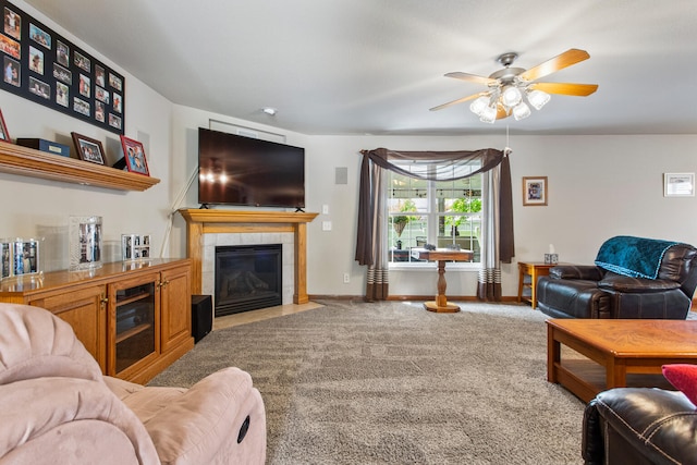 3807 Sandstone Dr, Champaign, IL 61822 - carpeted living room with ceiling fan, a fireplace, and baseboards