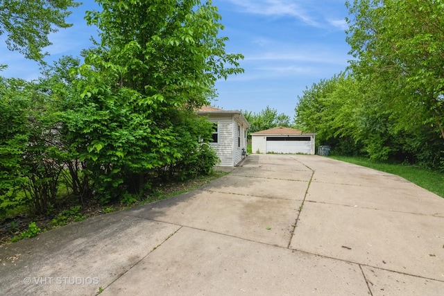 1180 Apple St, Hoffman Estates, IL 60169 - view of home's exterior with a detached garage and an outdoor structure