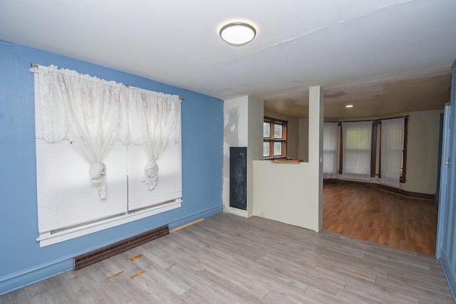 937 N County St, Waukegan, IL 60085 - unfurnished room with wood finished floors and baseboards