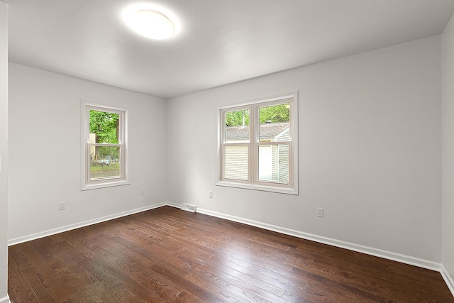 21402 S 79th Ave, Frankfort, IL 60423 - spare room featuring healthy amount of natural light, dark wood-style flooring, and baseboards