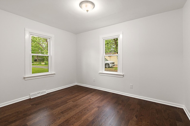 21402 S 79th Ave, Frankfort, IL 60423 - unfurnished room with plenty of natural light, dark wood finished floors, and baseboards