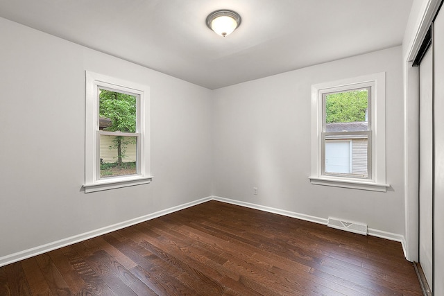 21402 S 79th Ave, Frankfort, IL 60423 - spare room featuring plenty of natural light, dark wood-style flooring, and baseboards