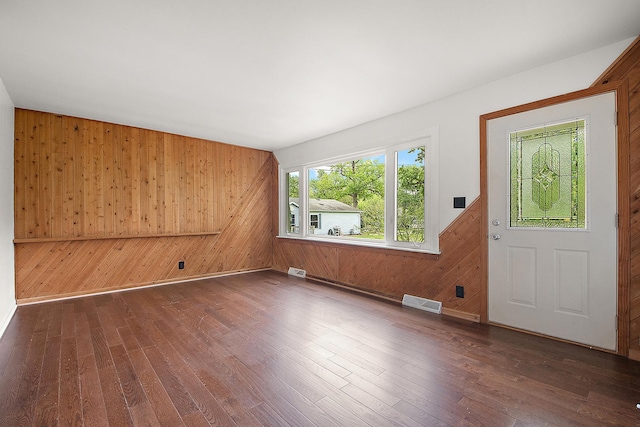 21402 S 79th Ave, Frankfort, IL 60423 - spare room with wood walls and dark wood-type flooring