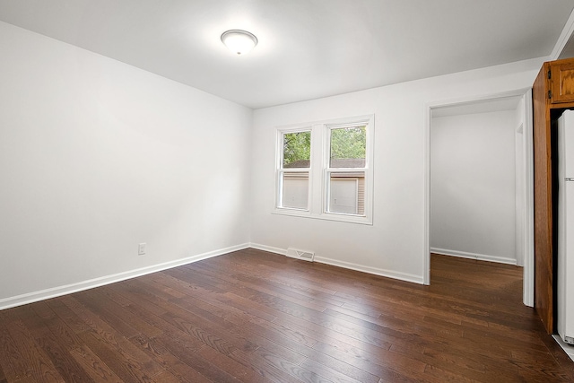 21402 S 79th Ave, Frankfort, IL 60423 - unfurnished bedroom featuring dark wood-style floors and baseboards