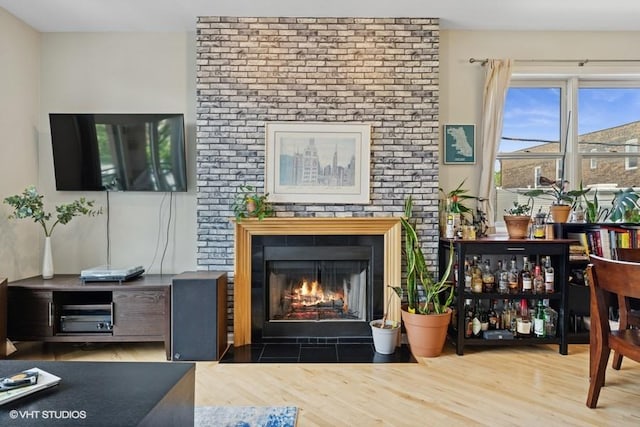 2215 W Augusta Blvd Unit 2E, Chicago, IL 60622 - living area featuring a fireplace and wood finished floors