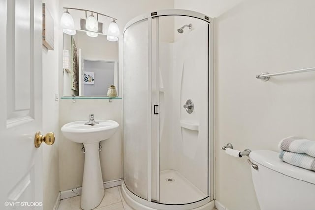 2215 W Augusta Blvd Unit 2E, Chicago, IL 60622 - full bathroom featuring a shower stall, tile patterned floors, toilet, and baseboards