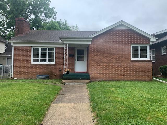 321 E Washington St, Ottawa, IL 61350 - view of front of house featuring brick siding, a chimney, and entry steps