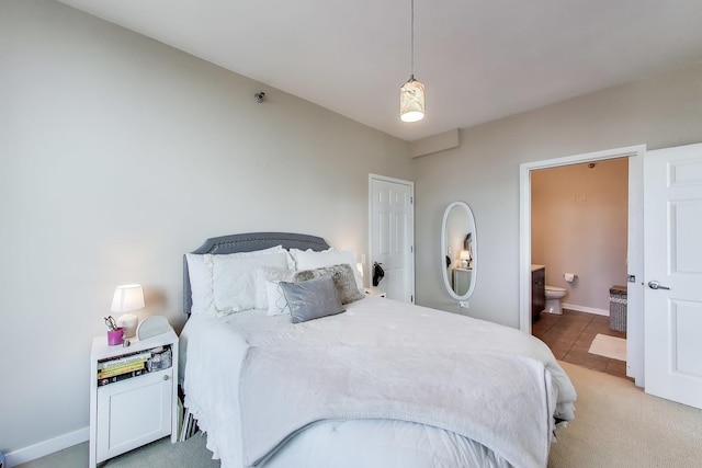 757 N Orleans St Unit 909, Chicago, IL 60654 - bedroom featuring connected bathroom and baseboards