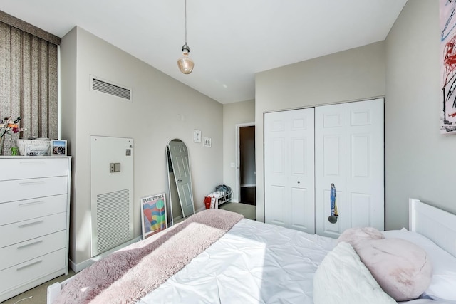 757 N Orleans St Unit 909, Chicago, IL 60654 - carpeted bedroom featuring a closet and lofted ceiling