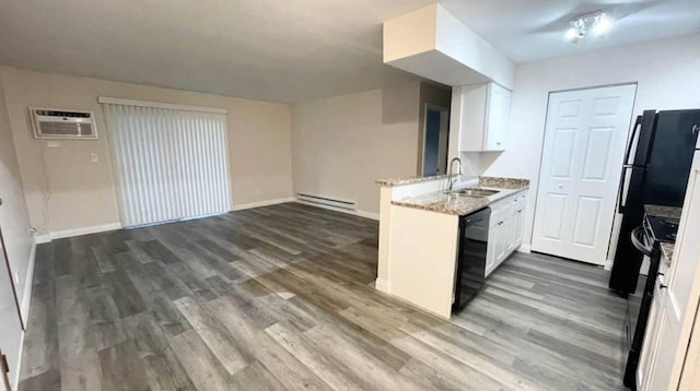 633 Virginia Rd Unit 116, Crystal Lake, IL 60014 - kitchen featuring baseboard heating, a sink, dishwasher, a peninsula, and dark wood finished floors