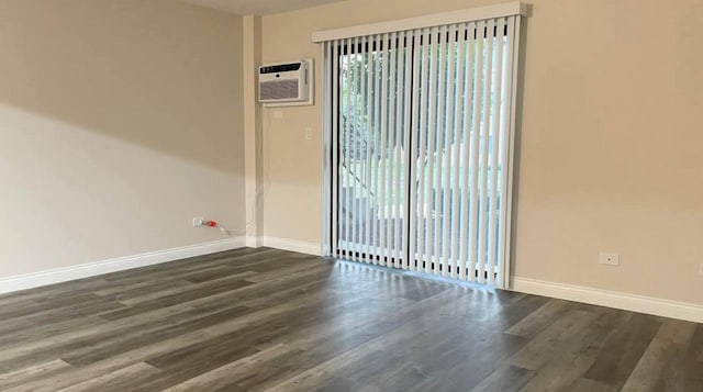 633 Virginia Rd Unit 116, Crystal Lake, IL 60014 - empty room with baseboards, dark wood-type flooring, and a wall unit AC