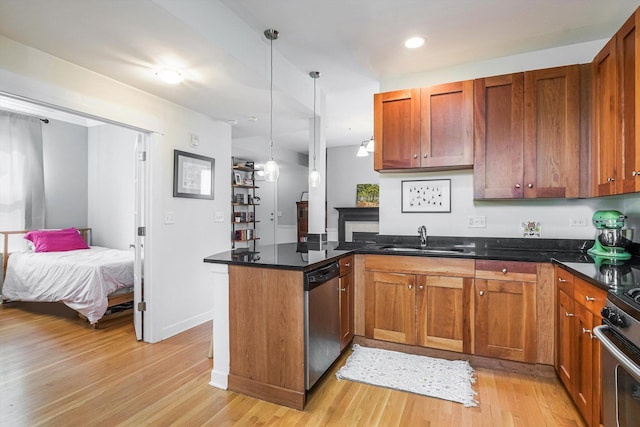 626 Judson Ave Unit 3, Evanston, IL 60202 - kitchen featuring stainless steel dishwasher, a sink, a peninsula, light wood-type flooring, and brown cabinetry