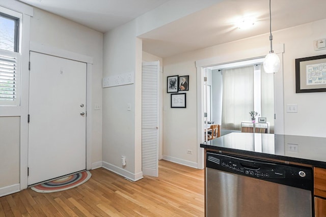 626 Judson Ave Unit 3, Evanston, IL 60202 - kitchen featuring dishwasher, light wood-type flooring, dark countertops, baseboards, and pendant lighting