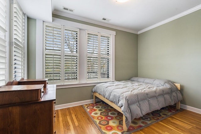 626 Judson Ave Unit 3, Evanston, IL 60202 - bedroom with crown molding, wood finished floors, and baseboards