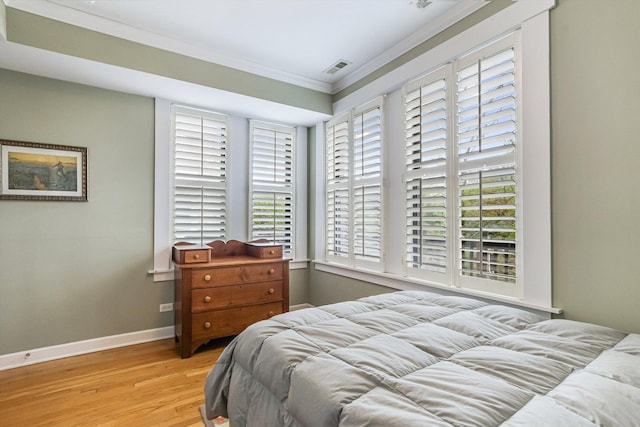 626 Judson Ave Unit 3, Evanston, IL 60202 - bedroom featuring ornamental molding, wood finished floors, and baseboards