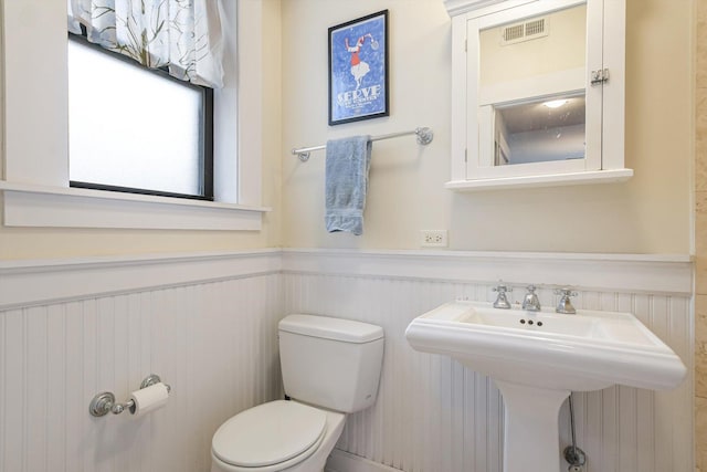 626 Judson Ave Unit 3, Evanston, IL 60202 - bathroom with a wainscoted wall, toilet, and a sink