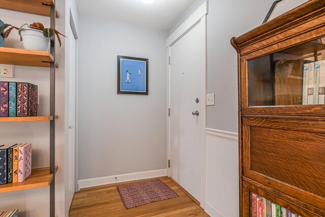 626 Judson Ave Unit 3, Evanston, IL 60202 - doorway to outside with light wood-style flooring and baseboards