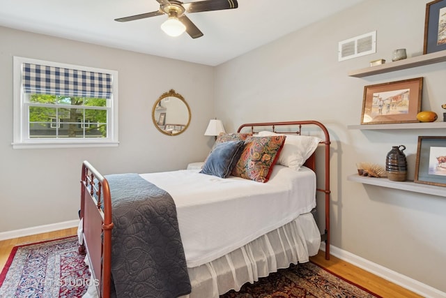 212 E 11th Ave, Naperville, IL 60563 - bedroom with wood finished floors, baseboards, and a ceiling fan