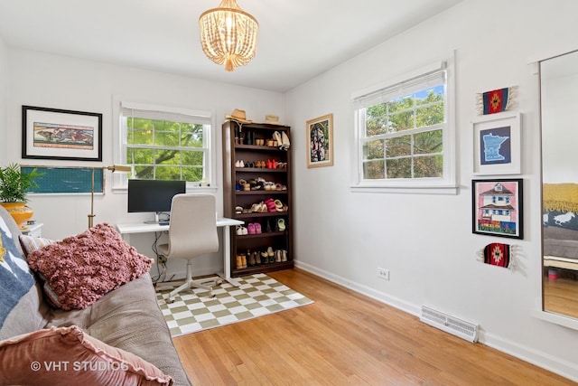 212 E 11th Ave, Naperville, IL 60563 - office with wood finished floors, a chandelier, and baseboards